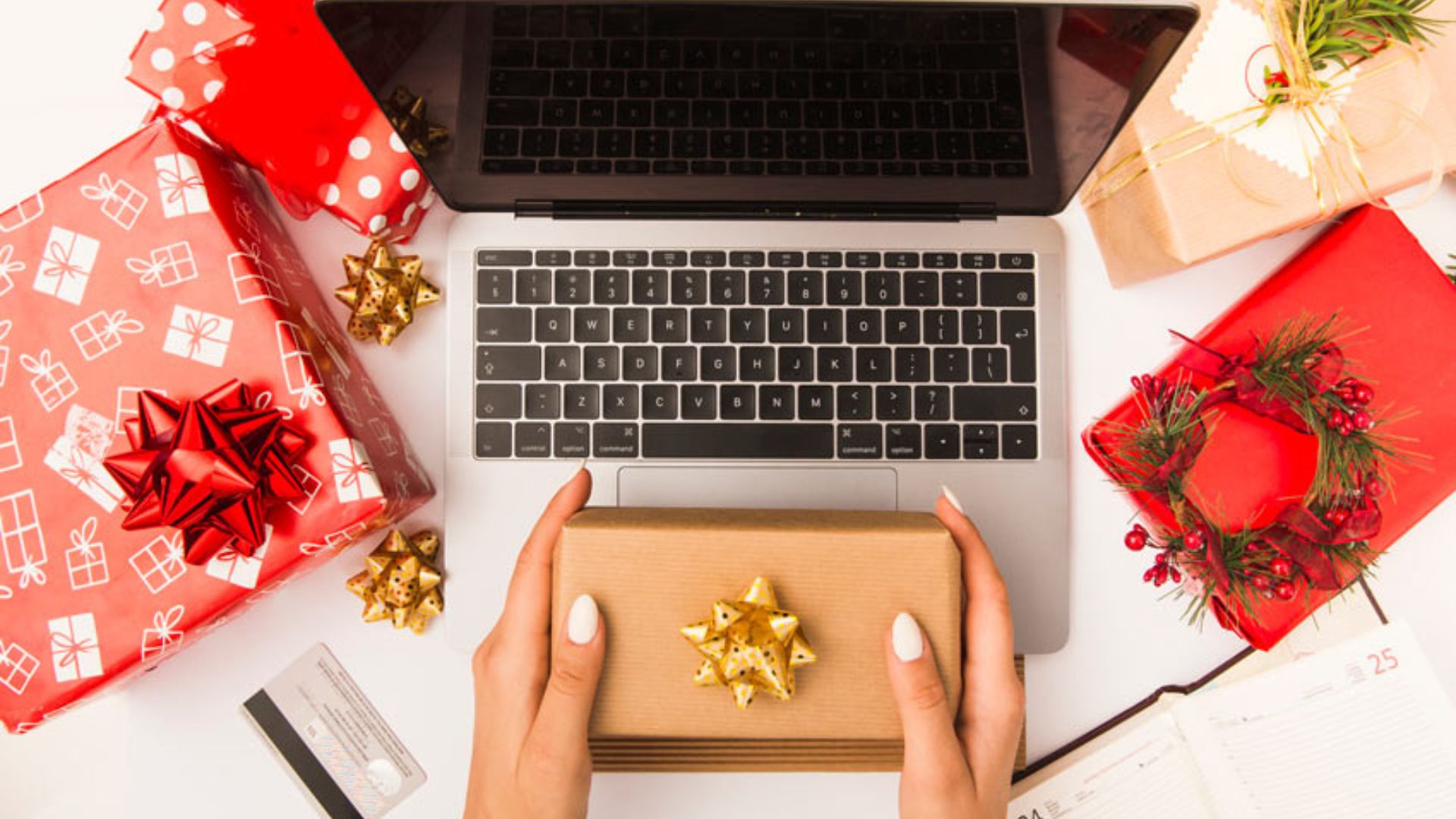 a laptop and a person holding a presents showing virtual presents