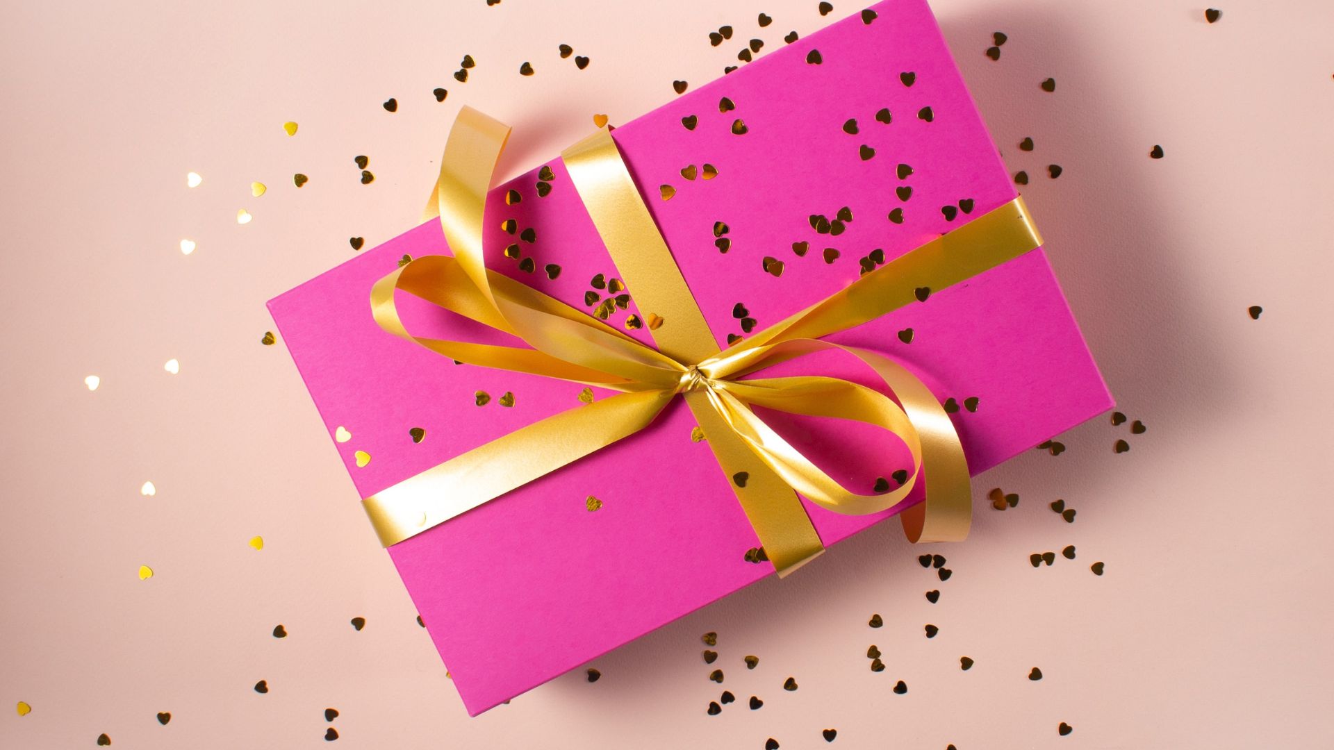 a present warpped with a pink paper