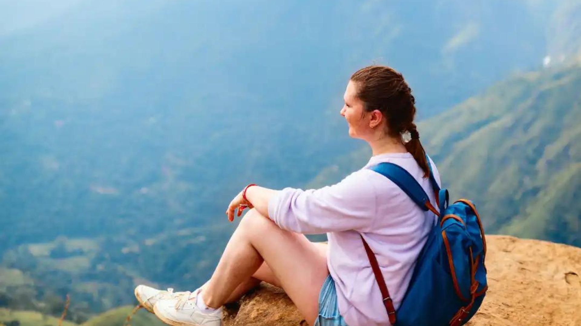 a lady sitting while viewing nature of the Unique Places for Solo Female Travelers in 2024